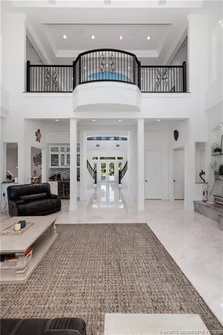 a bathroom with double vanity and a bathtub