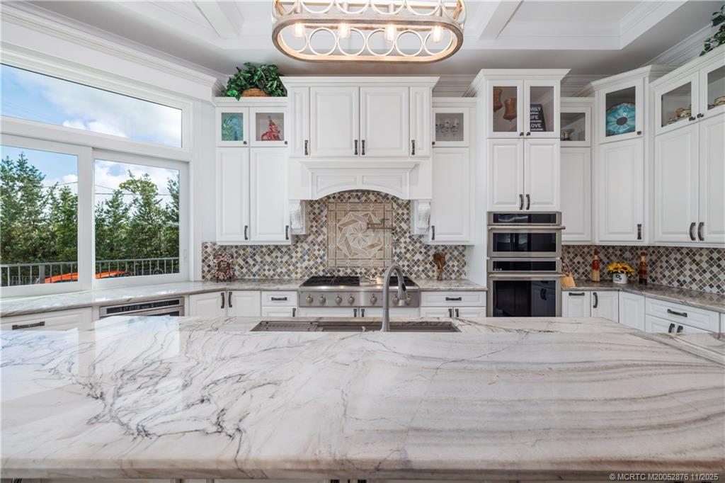 2346 Northwest Fork Road Stuart, FL 34994 - Photo 21 of 100 a view of kitchen with stainless steel appliances kitchen island