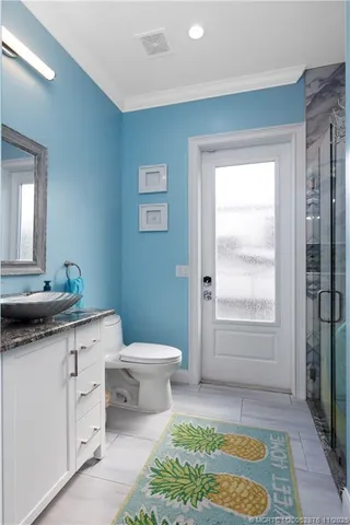 a view of a swimming pool with a patio and a yard