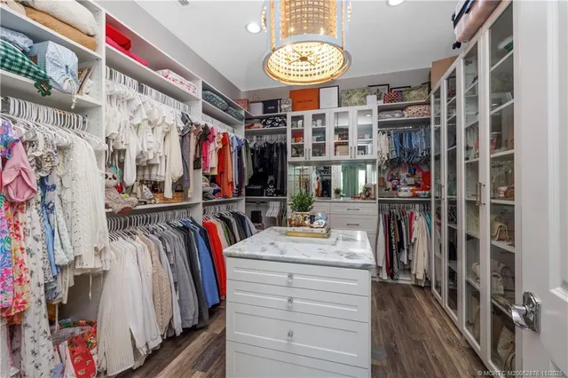 a open kitchen with stainless steel appliances granite countertop a stove a sink and a microwave