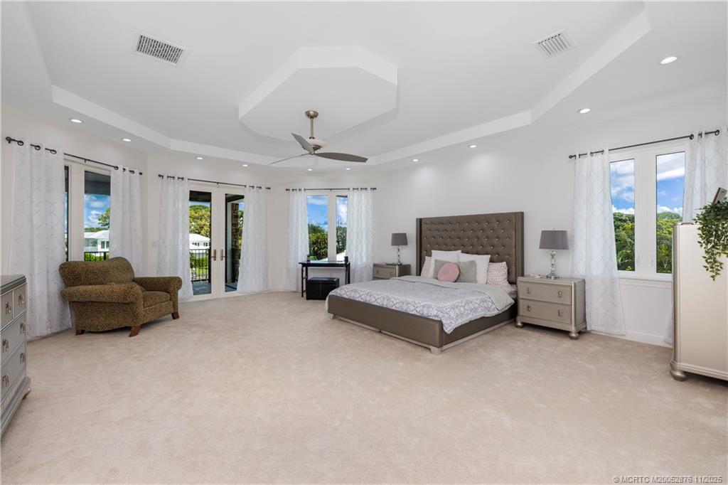 2346 Northwest Fork Road Stuart, FL 34994 - Photo 36 of 100 a spacious bedroom with a bed and furniture