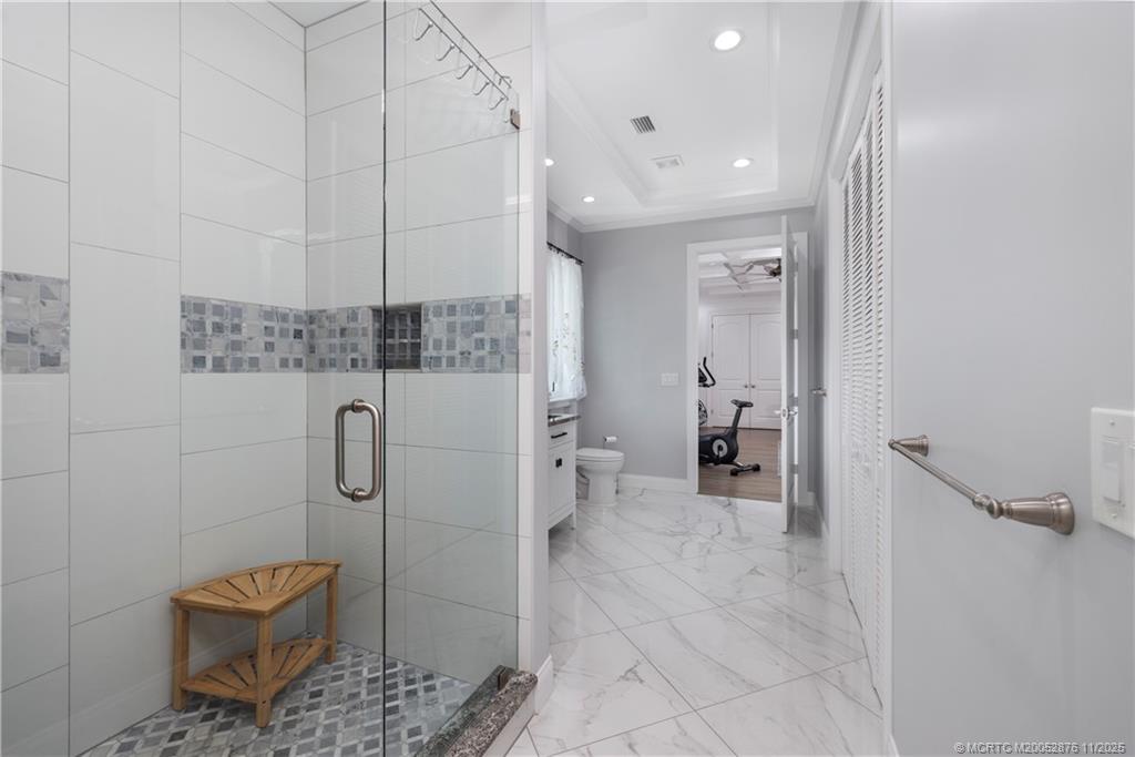 2346 Northwest Fork Road Stuart, FL 34994 - Photo 37 of 100 a bathroom with a shower and a toilet