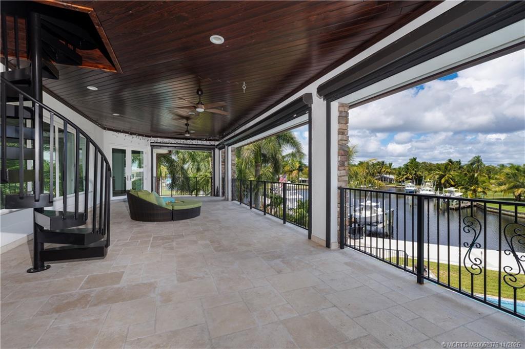 2346 Northwest Fork Road Stuart, FL 34994 - Photo 39 of 100 a view of a porch with furniture and a yard