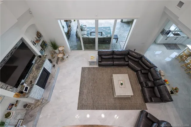 a kitchen with refrigerator and sink