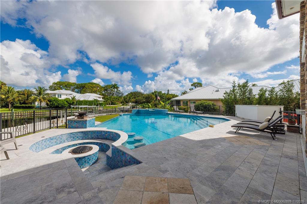 2346 Northwest Fork Road Stuart, FL 34994 - Photo 51 of 100 a view of swimming pool and lake view in back