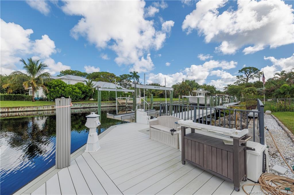 2346 Northwest Fork Road Stuart, FL 34994 - Photo 59 of 100 a view of a roof deck with couches and wooden floor