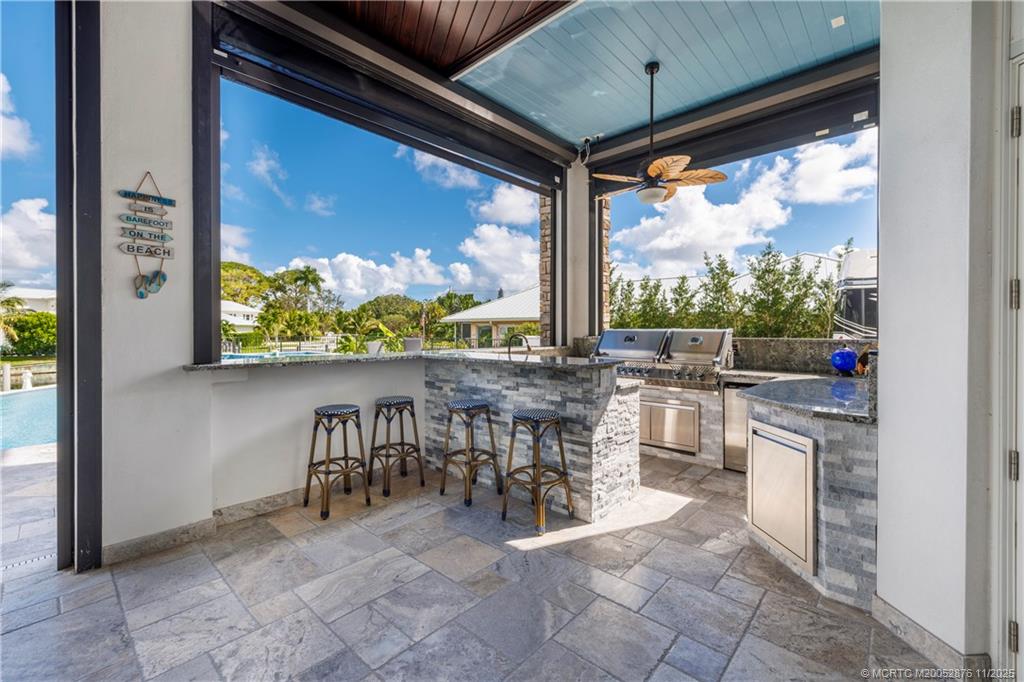 2346 Northwest Fork Road Stuart, FL 34994 - Photo 62 of 100 a room with lots of tables a large window and chairs