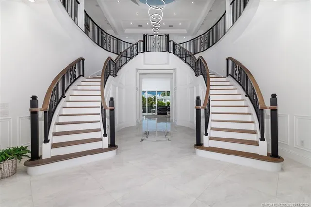a living room with furniture a large window and a fireplace