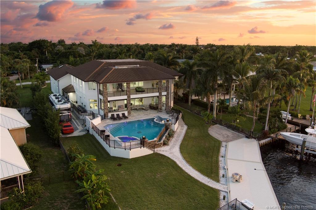 2346 Northwest Fork Road Stuart, FL 34994 - Photo 80 of 100 an aerial view of a house with a garden and lake view