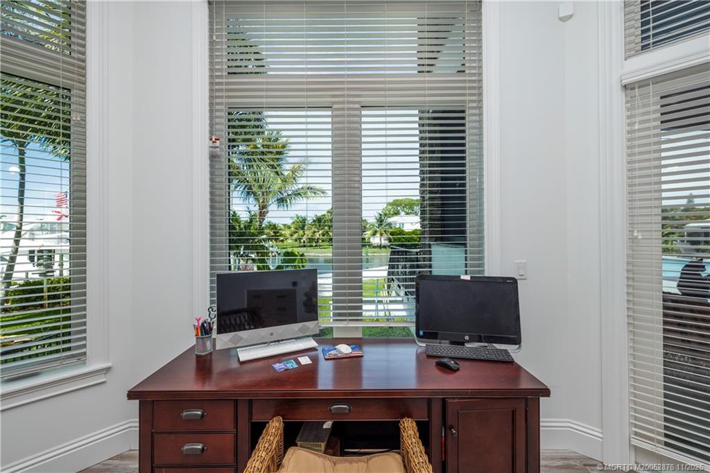 2346 Northwest Fork Road Stuart, FL 34994 - Photo 82 of 100 a view of a workspace with furniture and a window