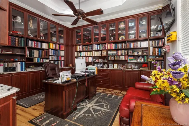 a kitchen with stainless steel appliances granite countertop a stove top oven a sink a dining table and chairs