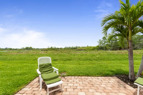 a view of a table and chairs in the garden