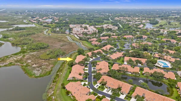 an aerial view of city and lake