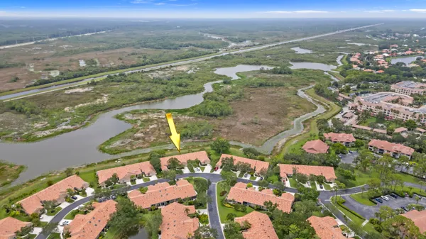 an aerial view of beach and residential houses with outdoor space