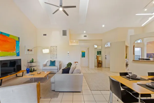 a living room with fireplace furniture and a flat screen tv