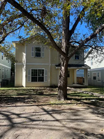 a front view of a house with stairs