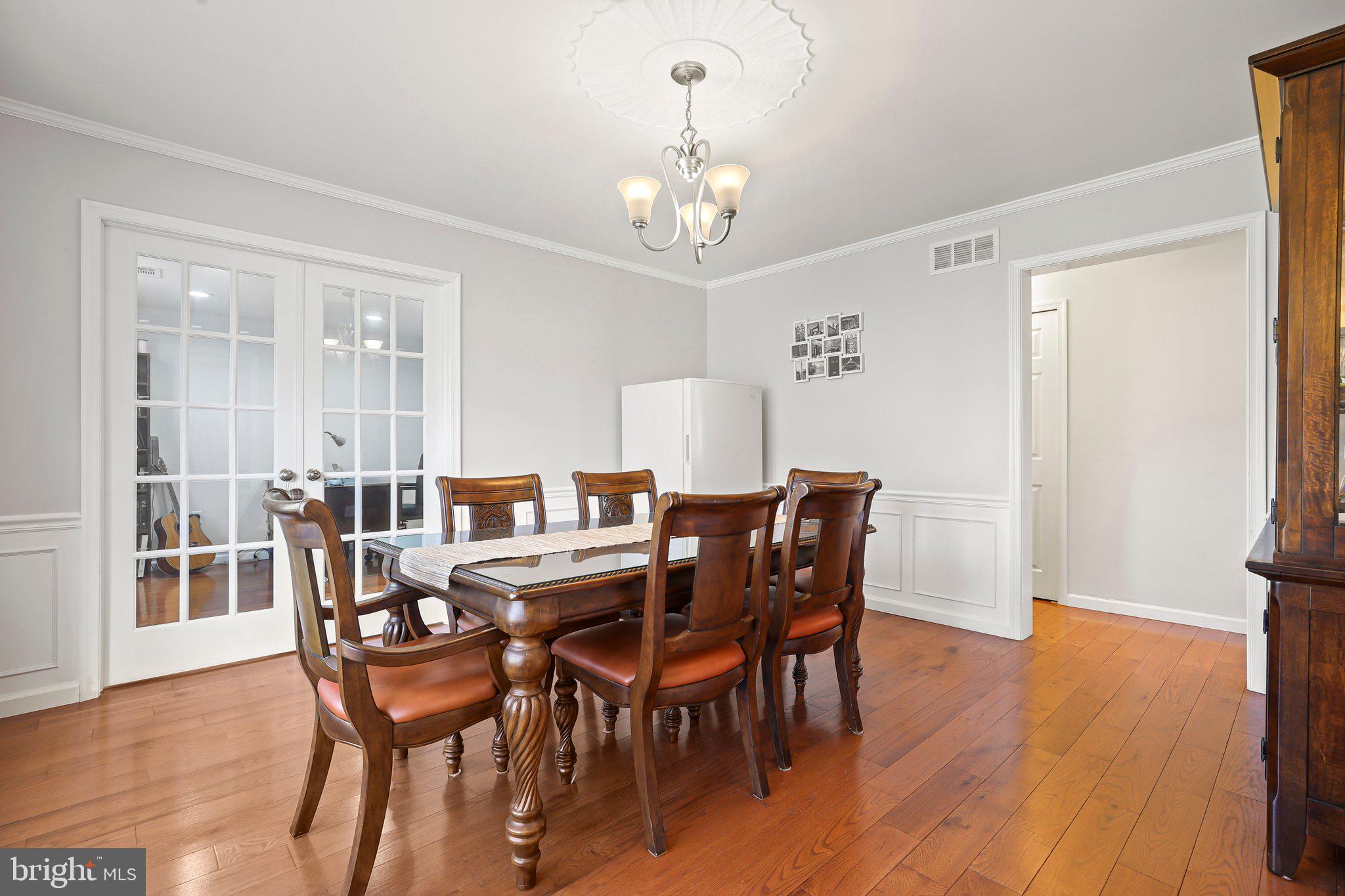 876 Henry Drive Yardley, PA 19067 - Photo 11 of 65 a view of a dining room with furniture wooden floor and chandelier