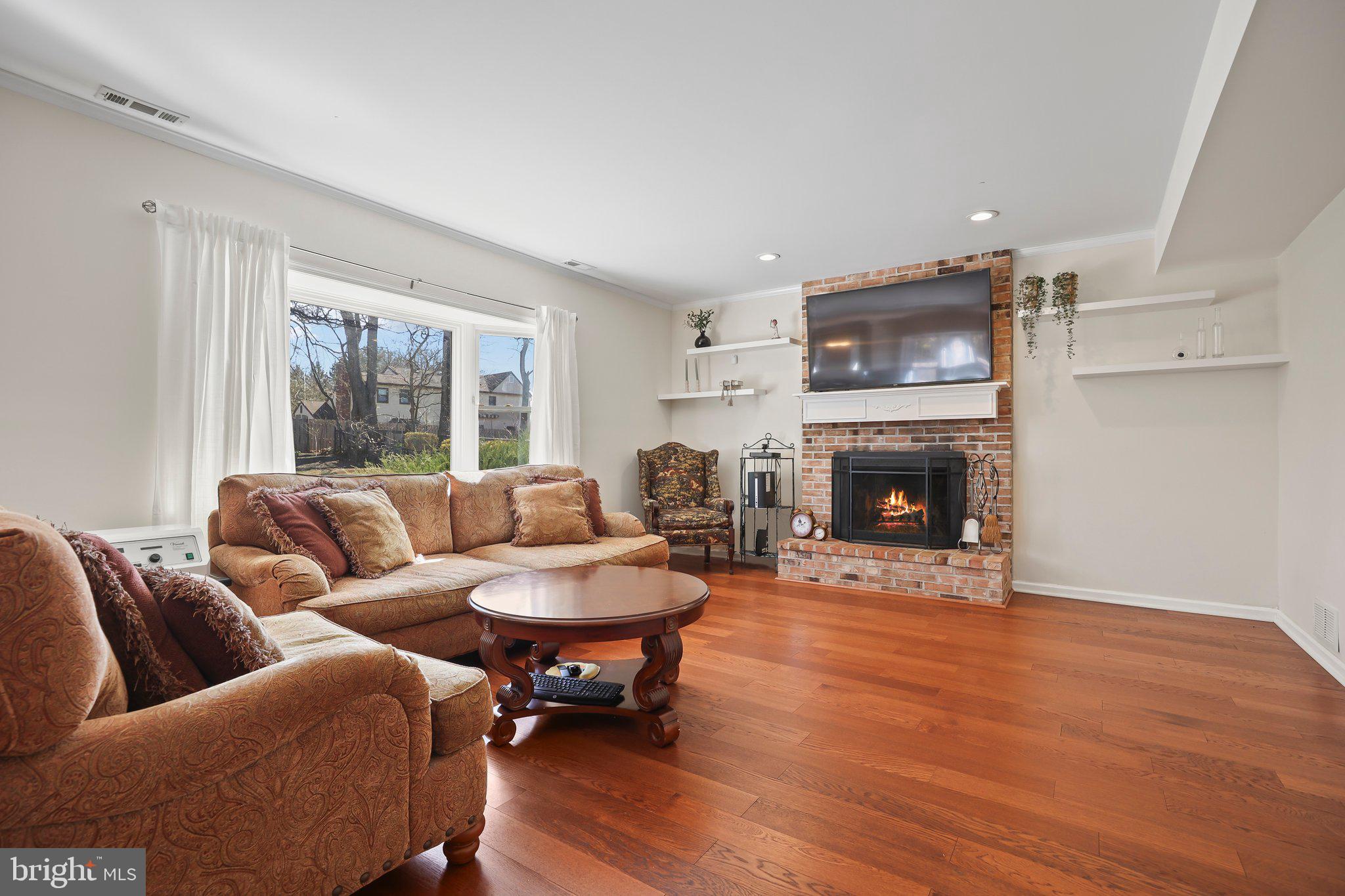 876 Henry Drive Yardley, PA 19067 - Photo 18 of 65 a living room with furniture and a fireplace