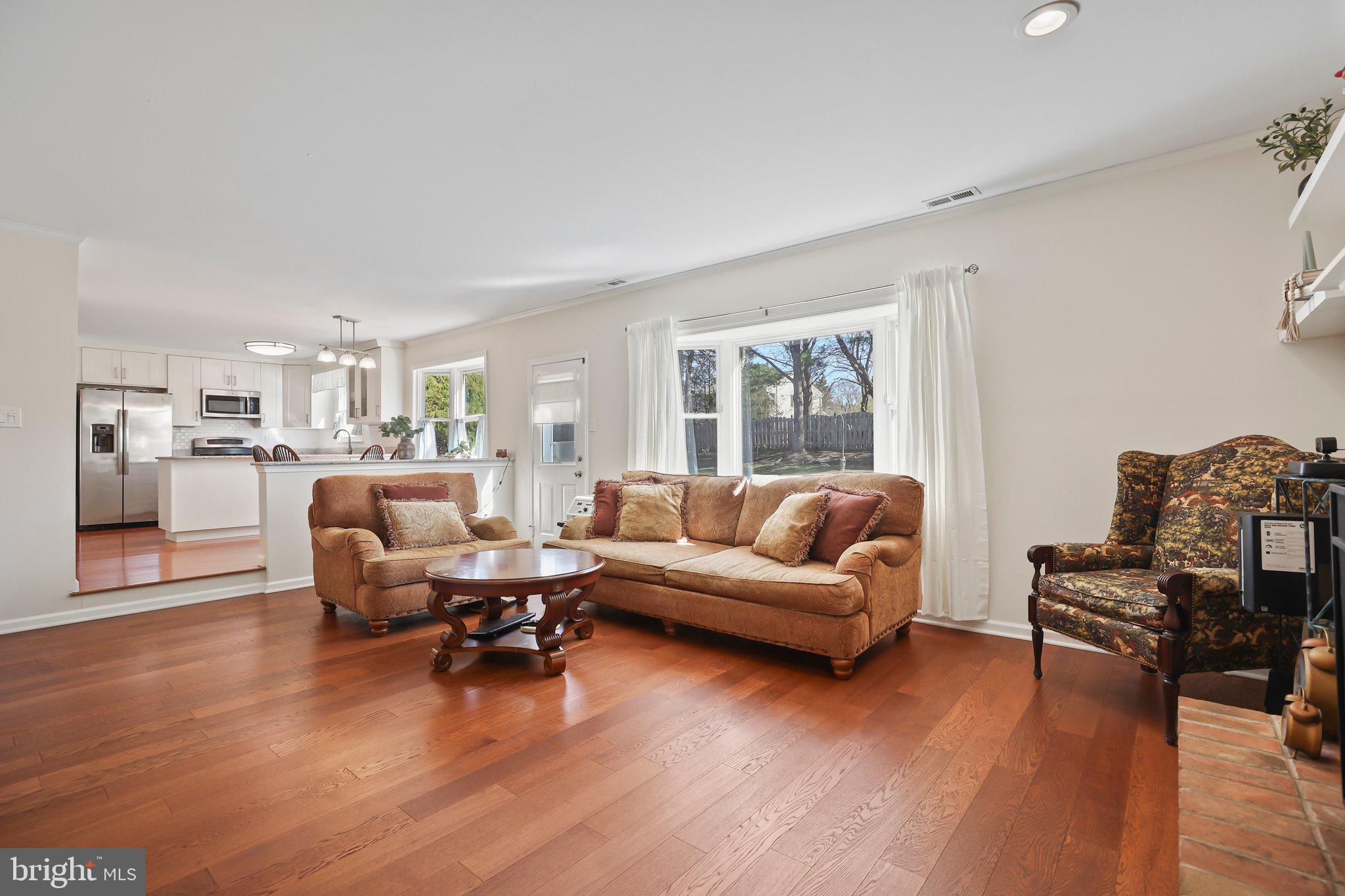 876 Henry Drive Yardley, PA 19067 - Photo 19 of 65 a living room with furniture and a wooden floor