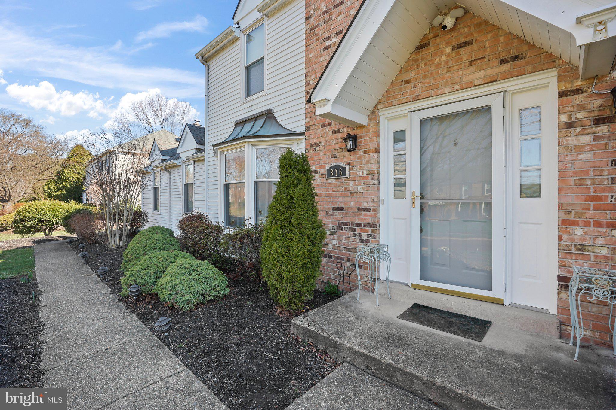 876 Henry Drive Yardley, PA 19067 - Photo 2 of 65 a front view of a house with a yard