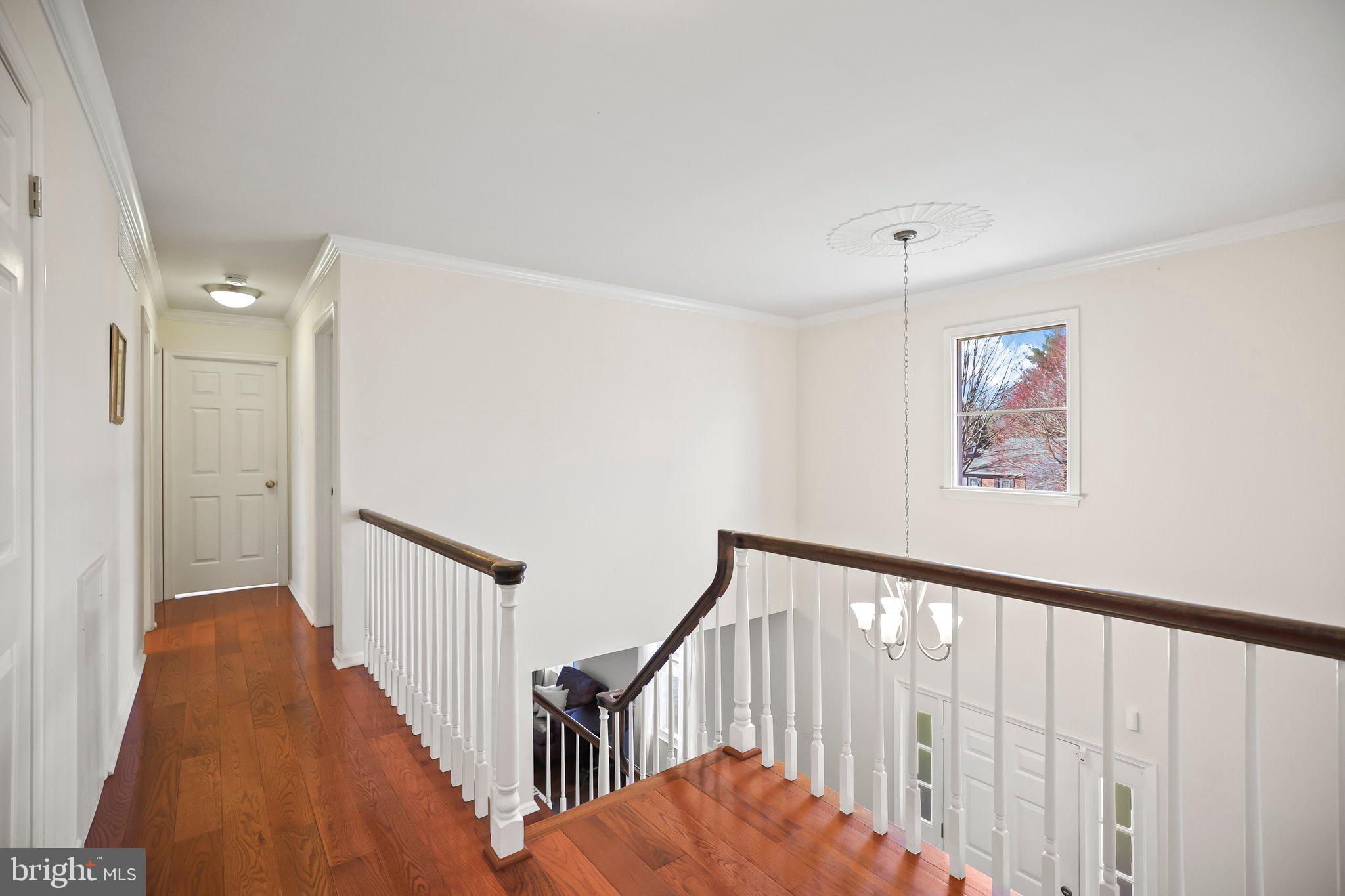 876 Henry Drive Yardley, PA 19067 - Photo 23 of 65 a view of staircase with railing and white walls