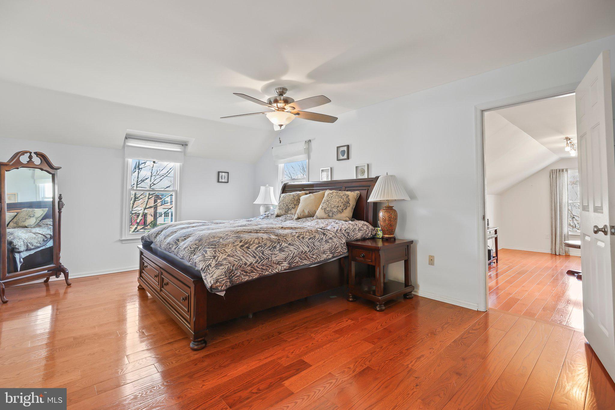 876 Henry Drive Yardley, PA 19067 - Photo 24 of 65 a bedroom with a bed dresser and a wooden floor