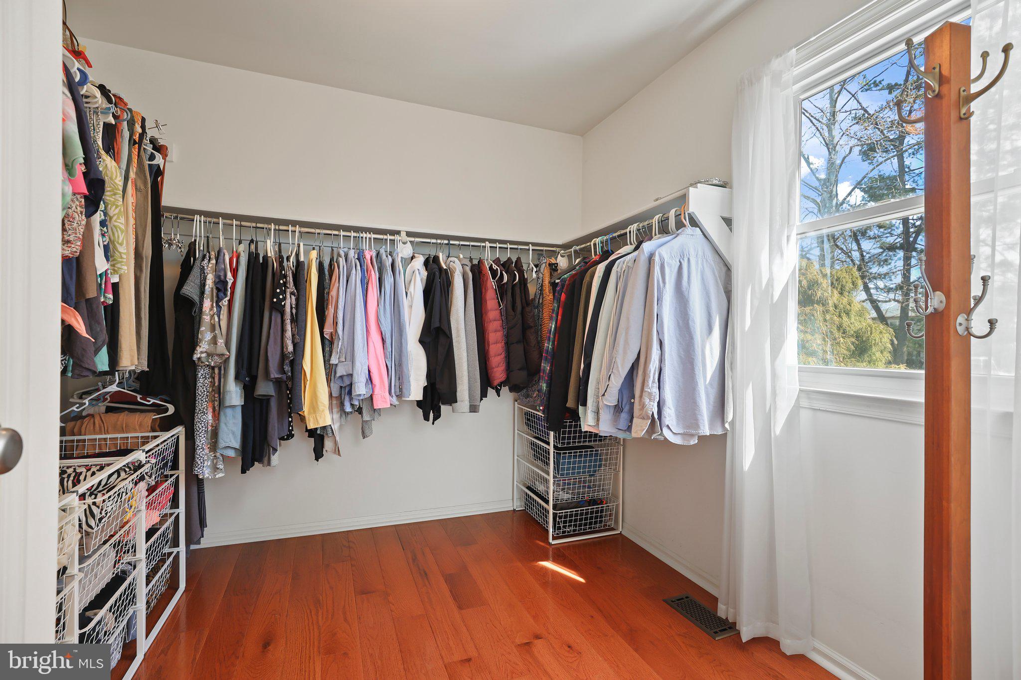 876 Henry Drive Yardley, PA 19067 - Photo 27 of 65 a view of walk in closet with clothes and shoes
