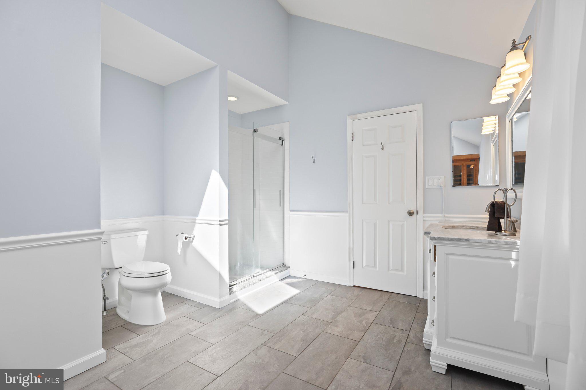 876 Henry Drive Yardley, PA 19067 - Photo 28 of 65 a bathroom with a sink a toilet and a mirror