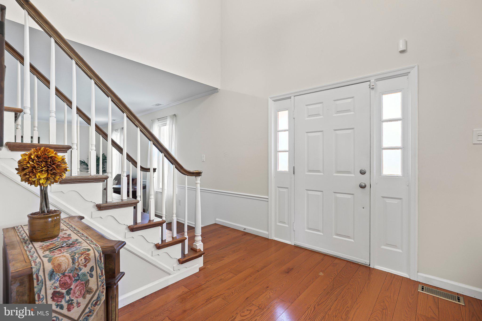 876 Henry Drive Yardley, PA 19067 - Photo 3 of 65 a view of entryway with wooden floor and stairs