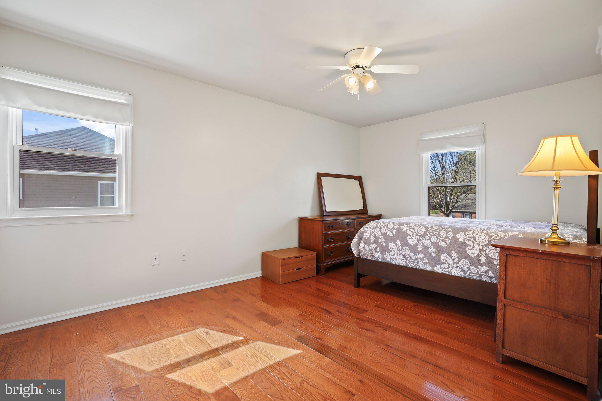876 Henry Drive Yardley, PA 19067 - Photo 32 of 65 a bedroom with a bed chandelier and a window