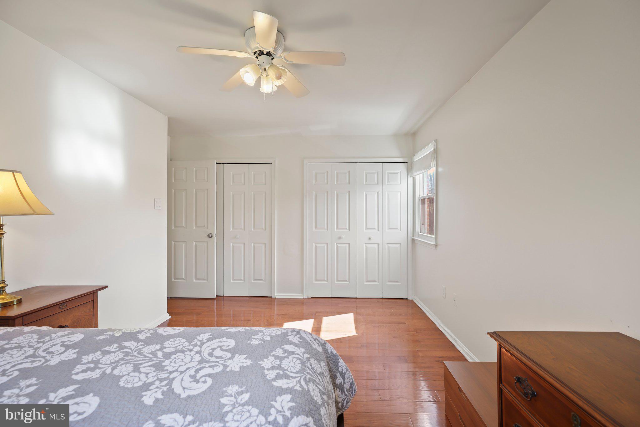 876 Henry Drive Yardley, PA 19067 - Photo 33 of 65 a bedroom with a bed and a chandelier