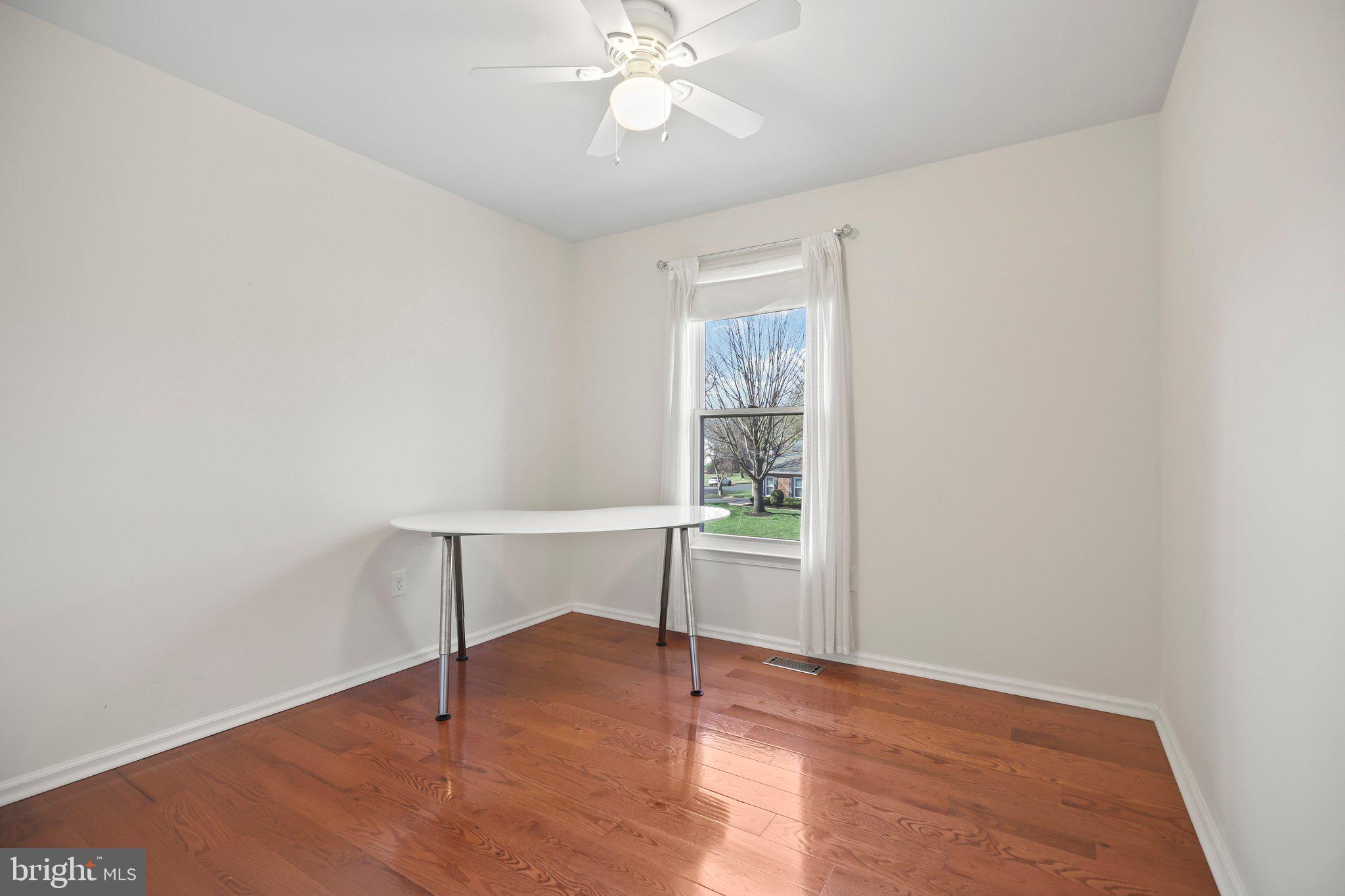 876 Henry Drive Yardley, PA 19067 - Photo 34 of 65 an empty room with windows and fan