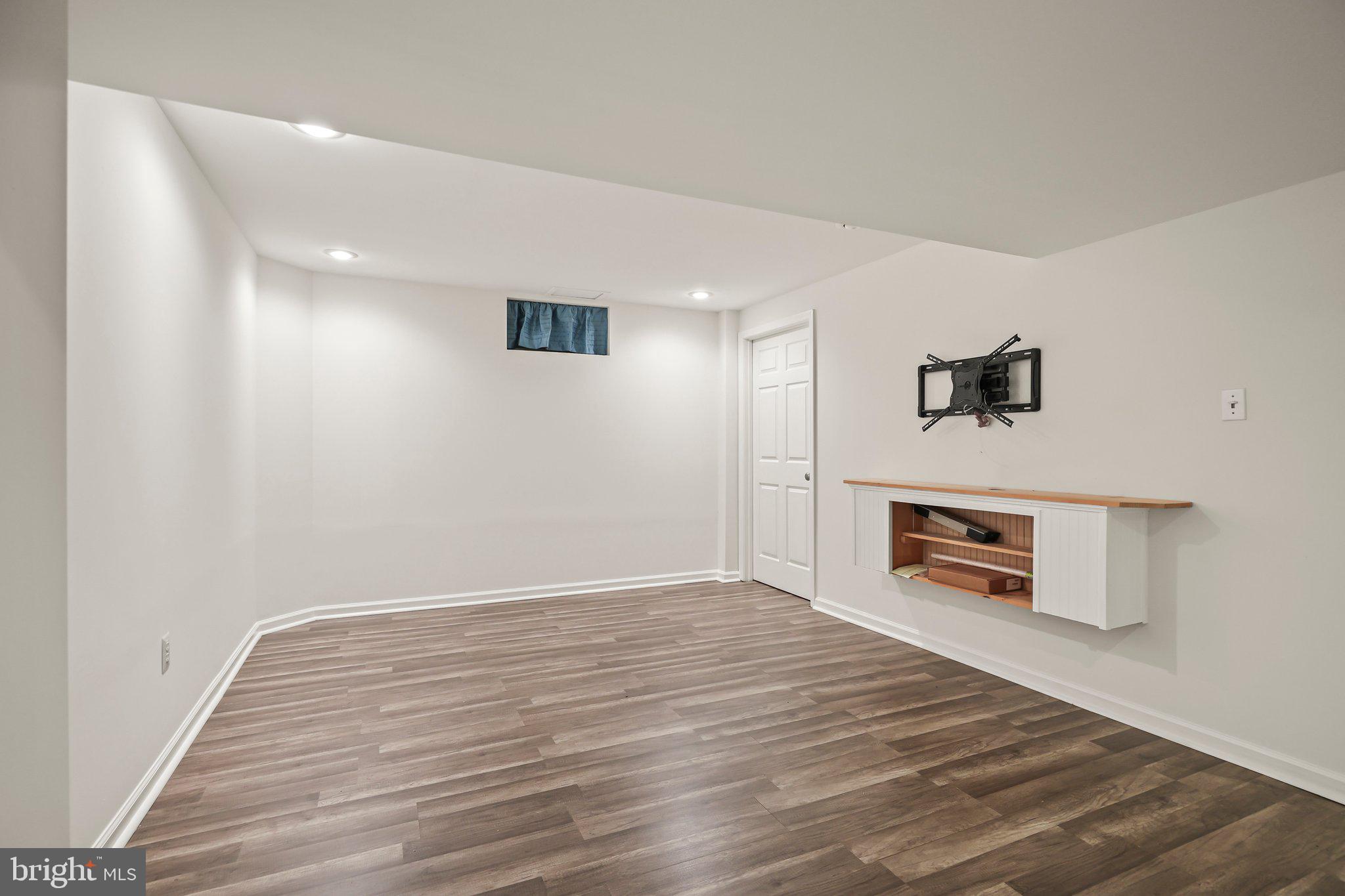 876 Henry Drive Yardley, PA 19067 - Photo 37 of 65 a view of empty room with wooden floor