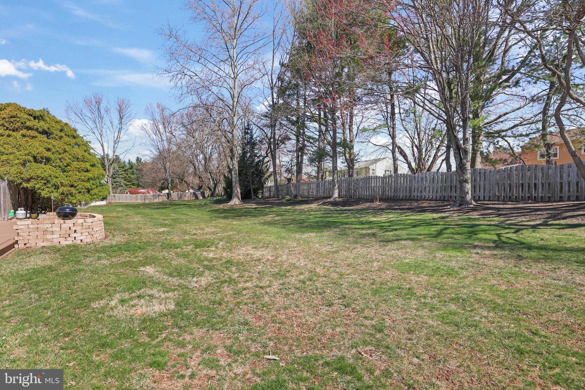876 Henry Drive Yardley, PA 19067 - Photo 44 of 65 a view of a yard with a house