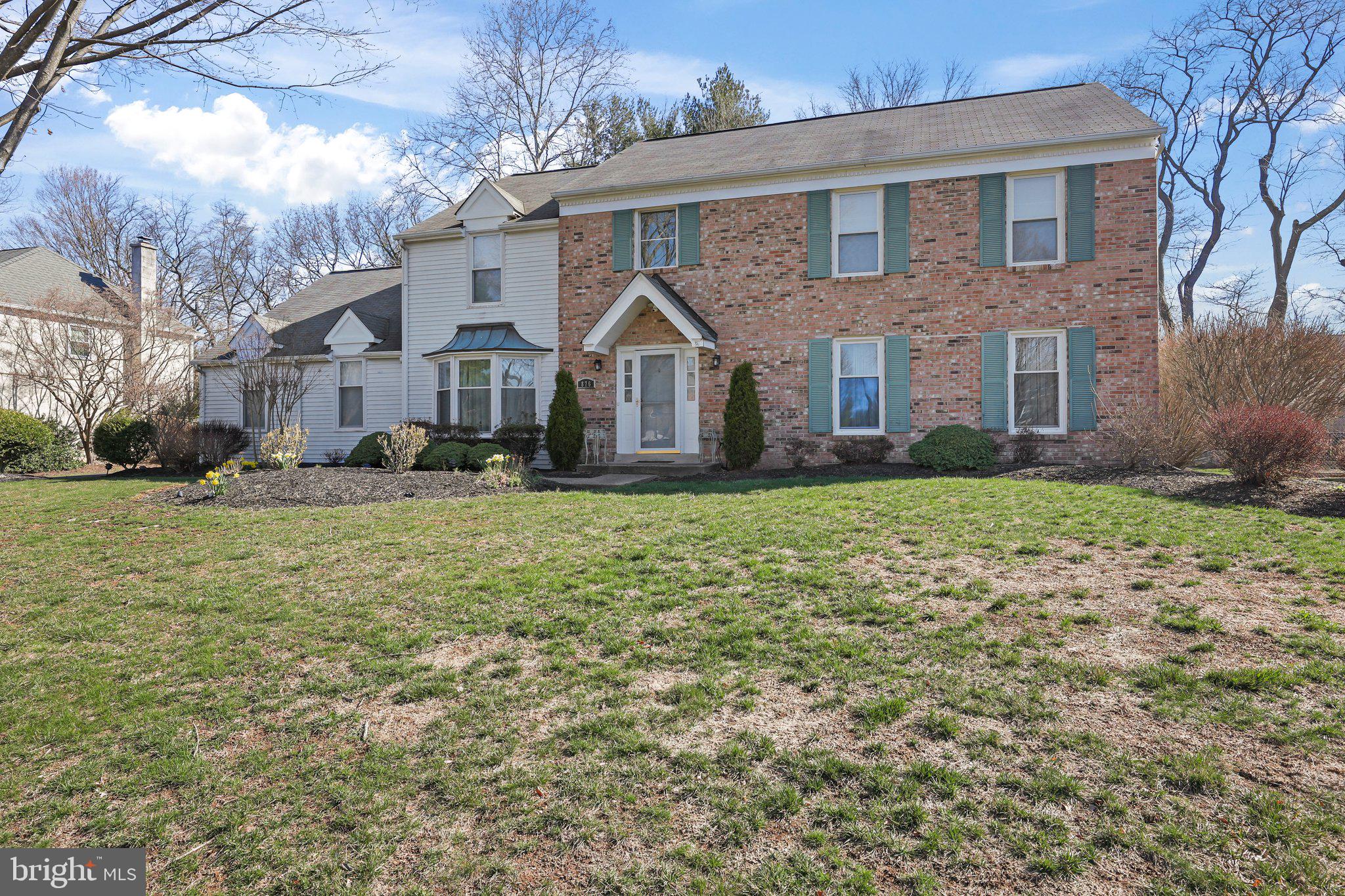 876 Henry Drive Yardley, PA 19067 - Photo 47 of 65 a front view of a house with a yard and trees