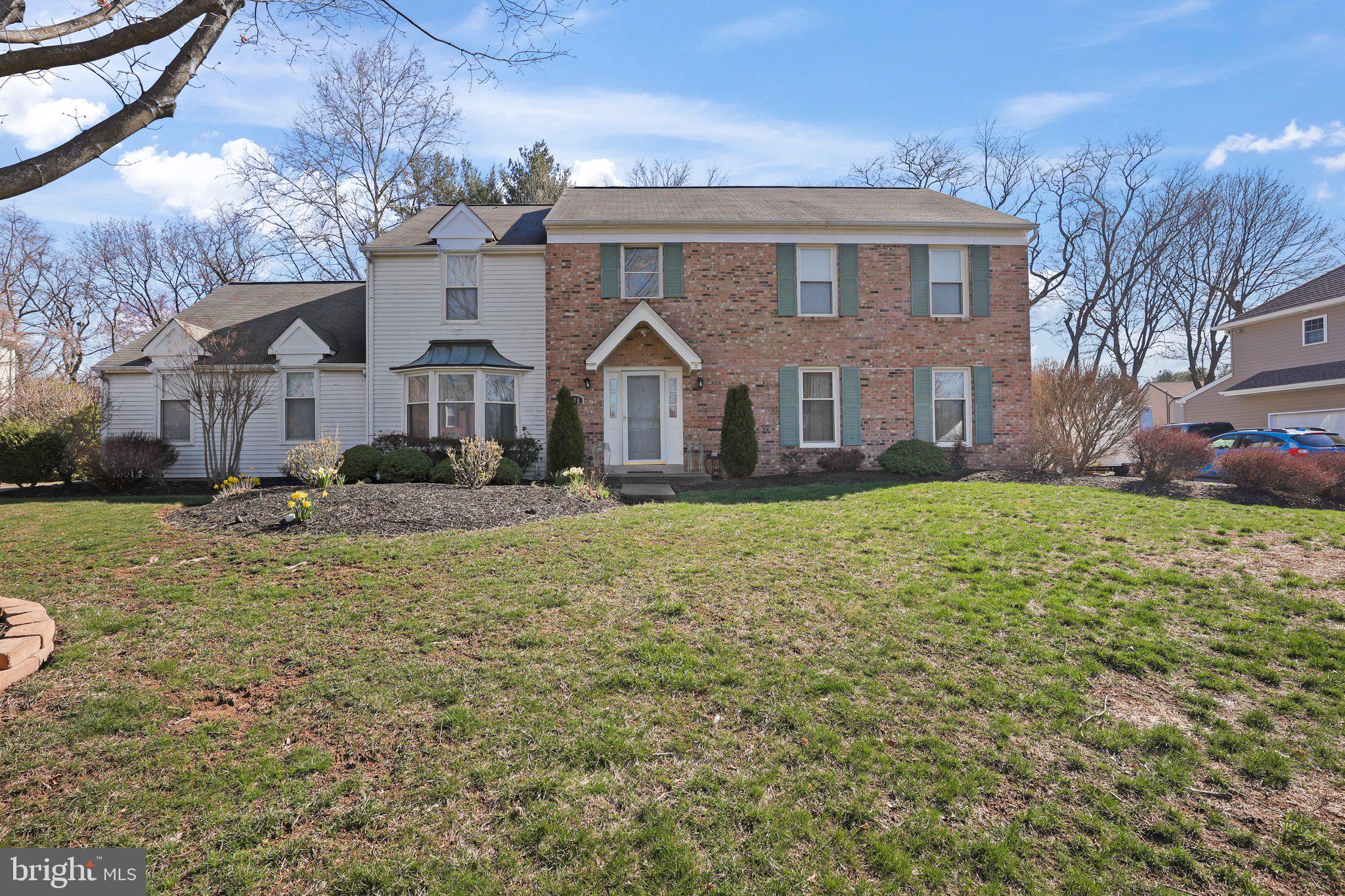 876 Henry Drive Yardley, PA 19067 - Photo 48 of 65 a front view of a house with a yard