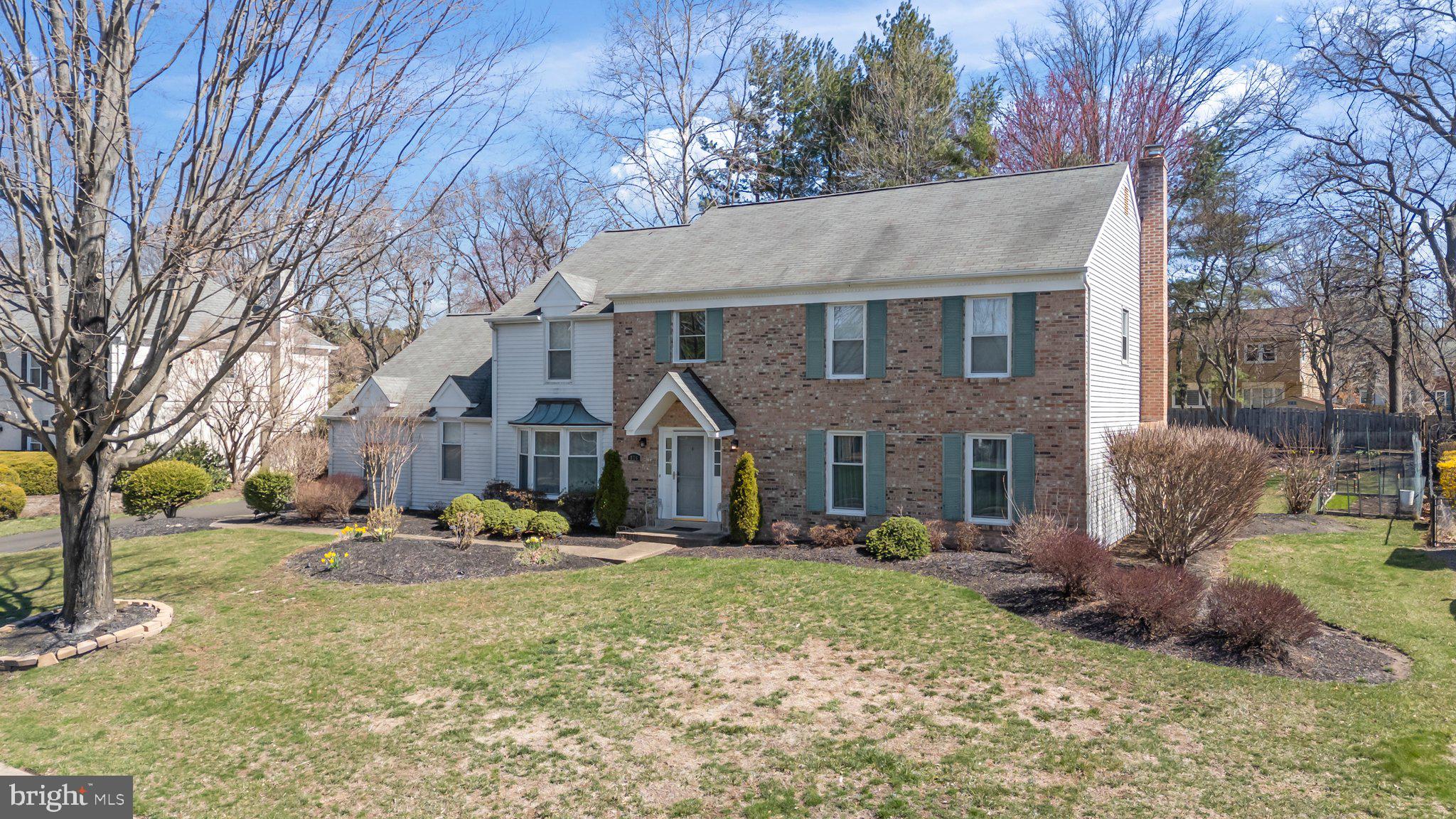 876 Henry Drive Yardley, PA 19067 - Photo 50 of 65 a view of a big house with a big yard and large trees