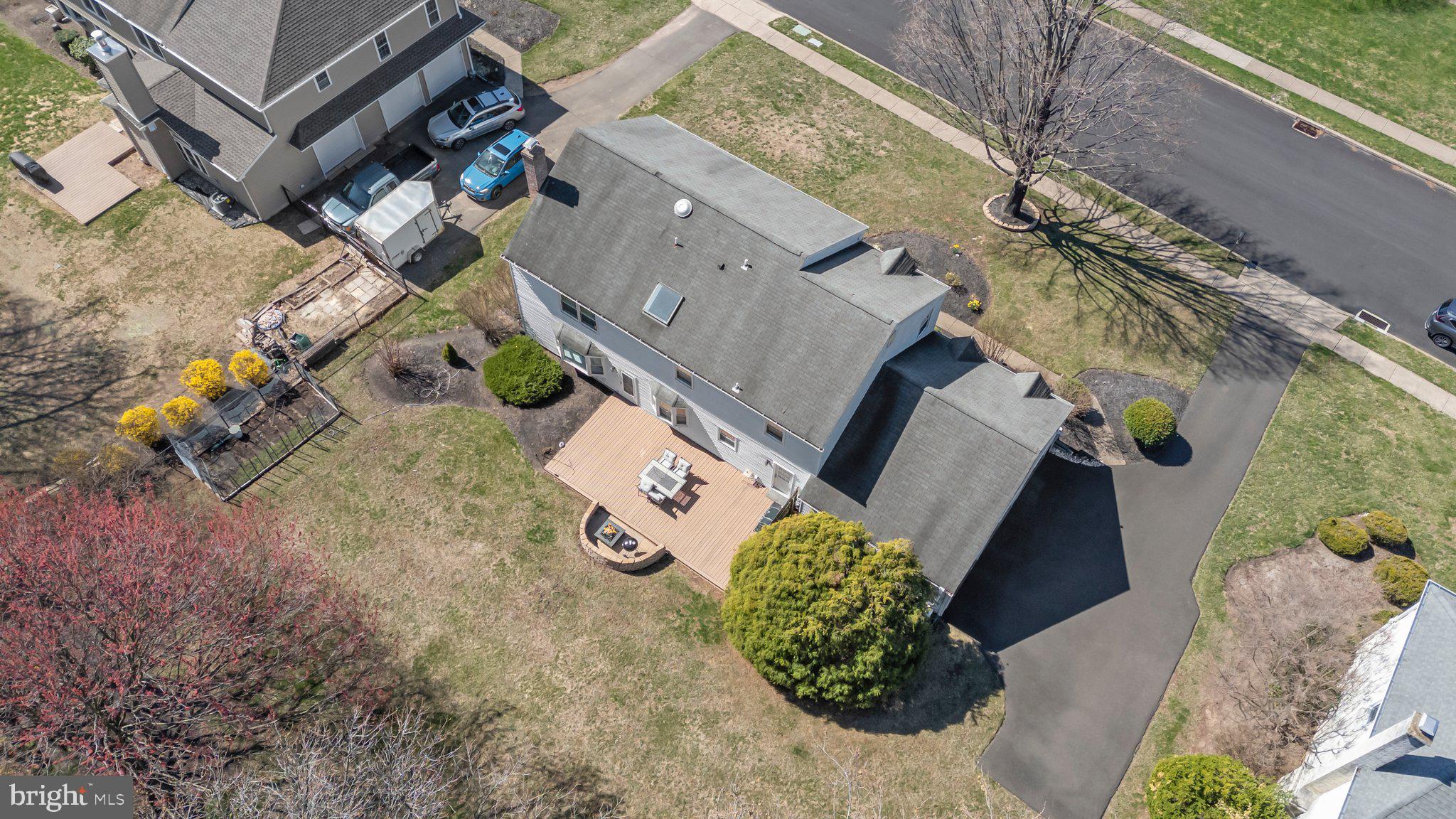 876 Henry Drive Yardley, PA 19067 - Photo 60 of 65 an aerial view of a house with a yard and garden