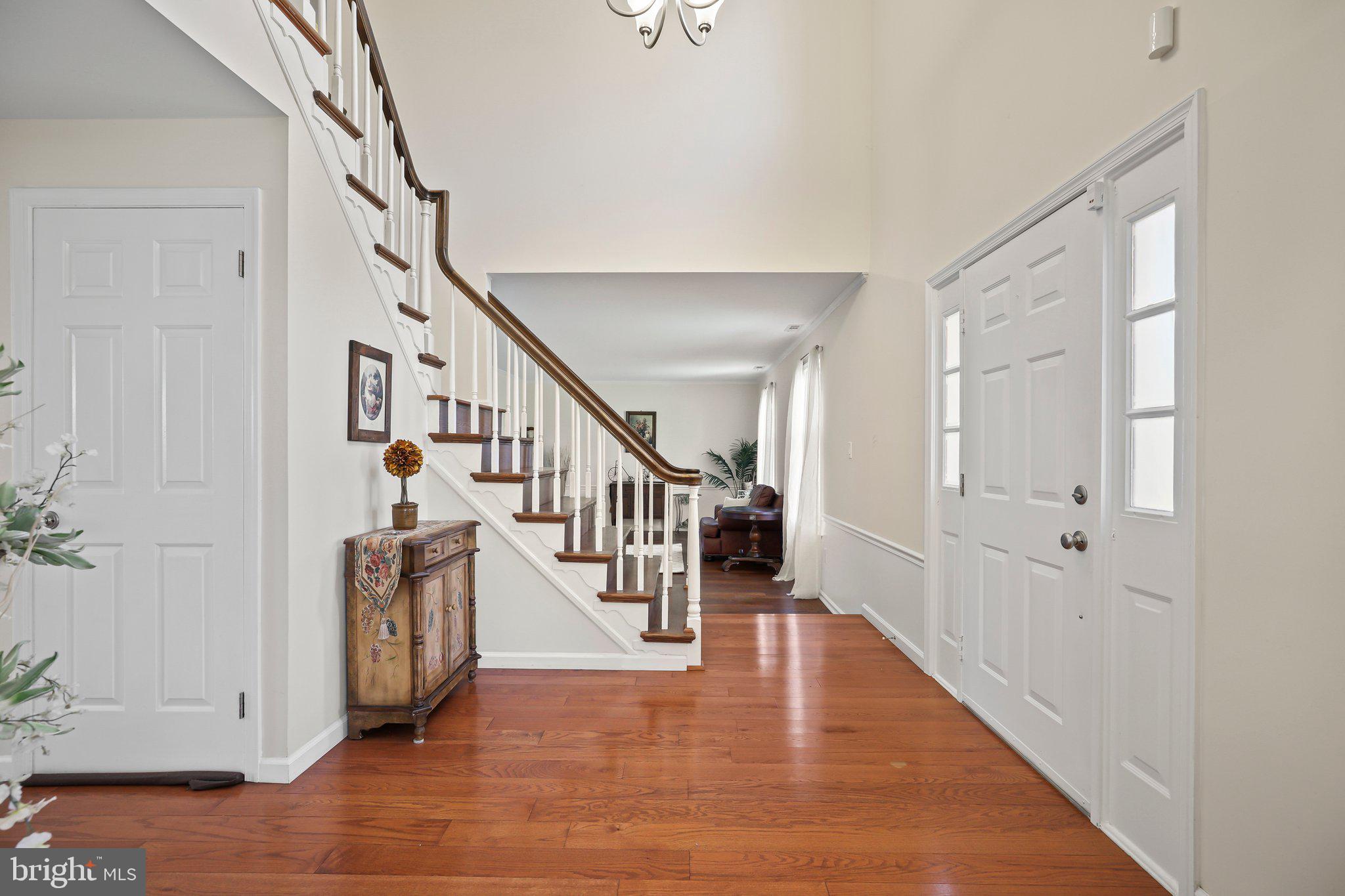 876 Henry Drive Yardley, PA 19067 - Photo 6 of 65 a view of entryway with stairs and wooden floor