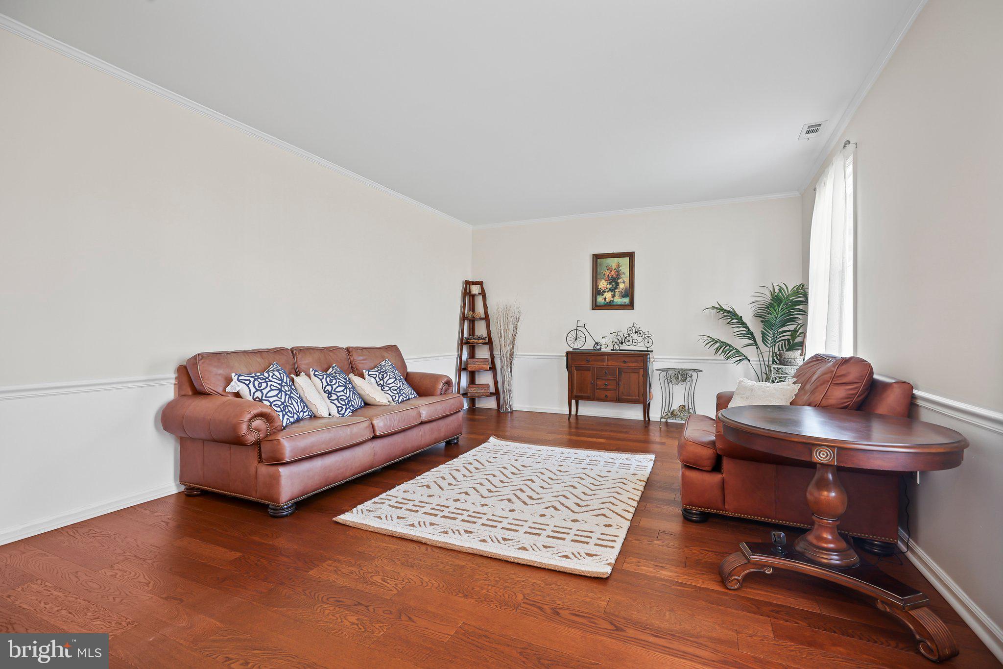 876 Henry Drive Yardley, PA 19067 - Photo 7 of 65 a living room with furniture and a rug