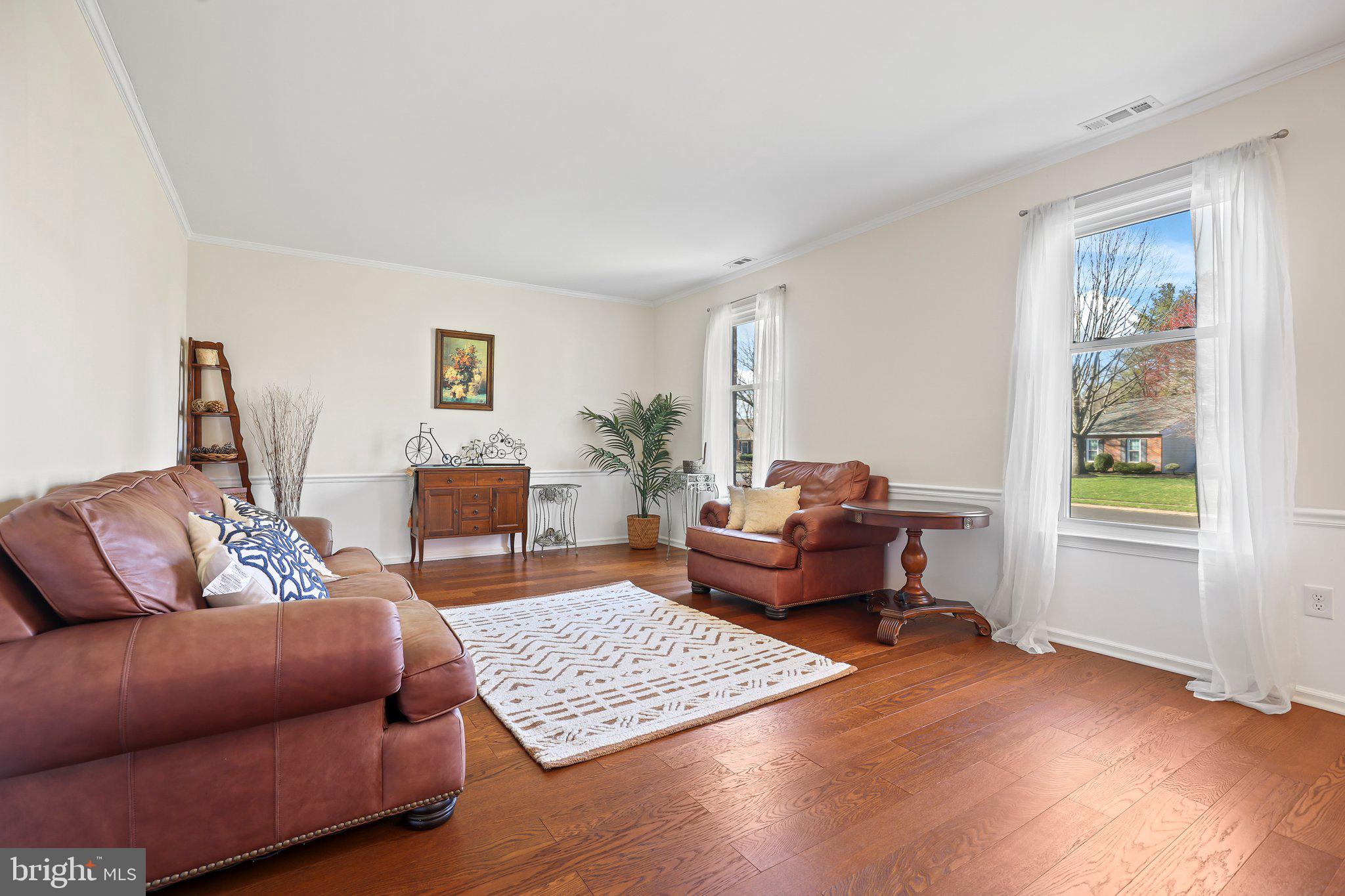 876 Henry Drive Yardley, PA 19067 - Photo 9 of 65 a living room with furniture and a wooden floor
