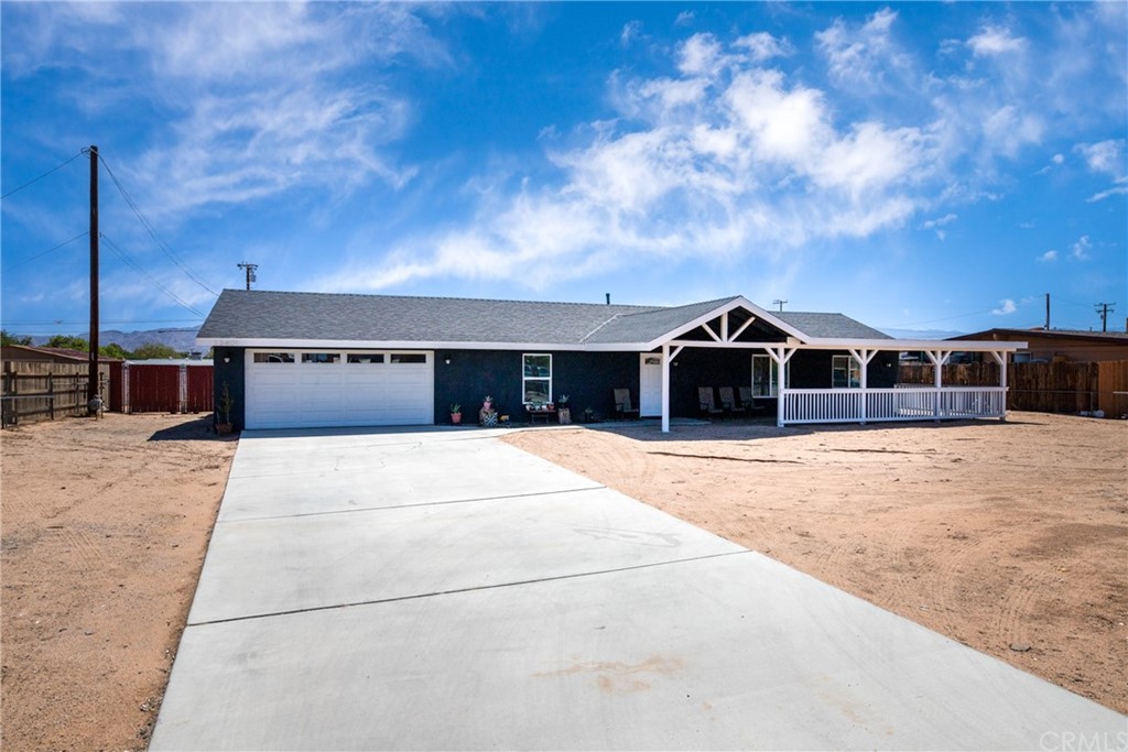 13401 Rancherias Road Apple Valley, CA 92308 - Photo 1 of 1 a front view of a house with a yard