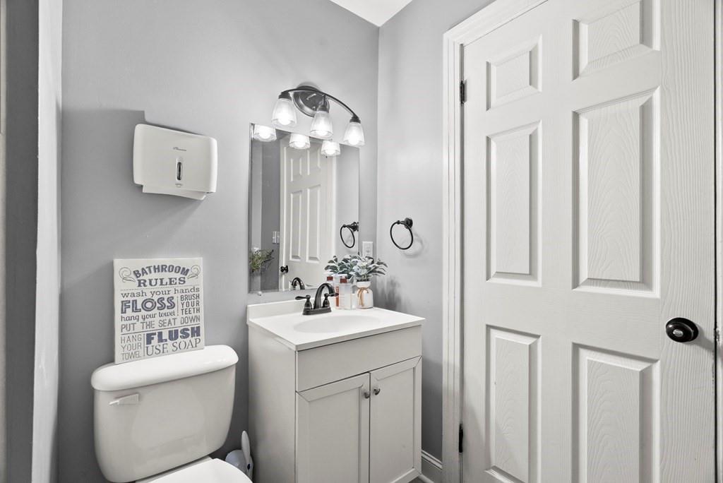 601 Juniper Avenue Dalton, GA 30721 - Photo 14 of 18 a bathroom with a toilet sink and mirror