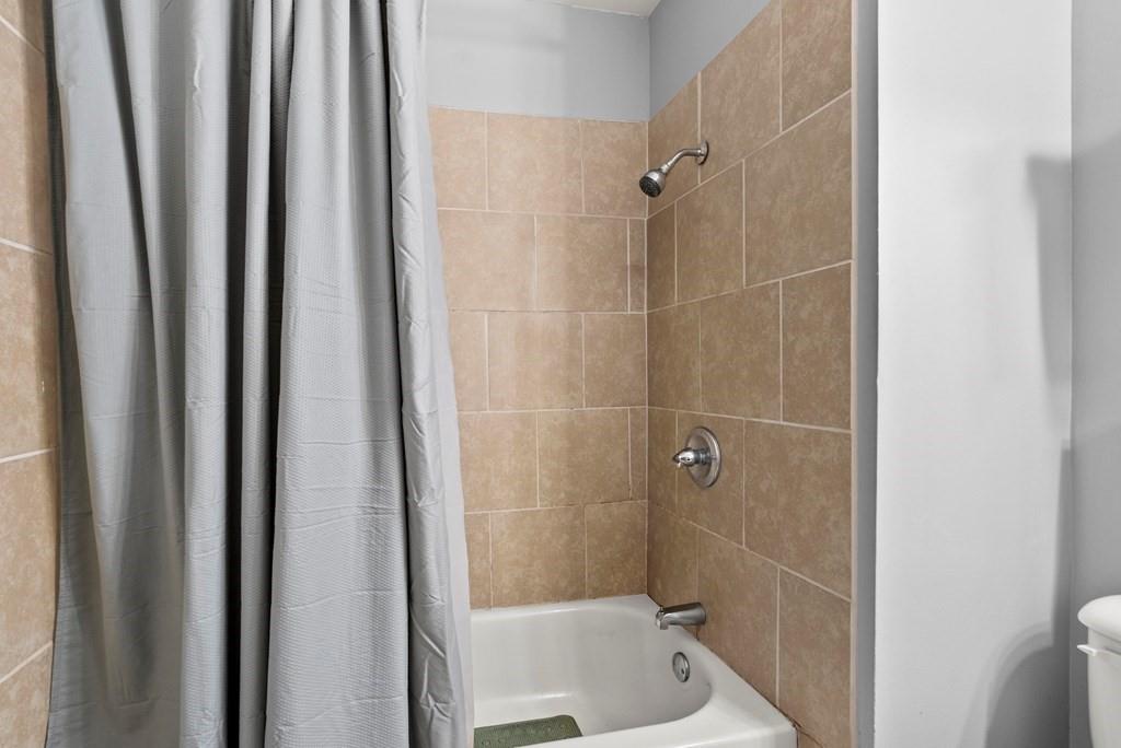 601 Juniper Avenue Dalton, GA 30721 - Photo 15 of 18 a bathroom with a shower and a sink