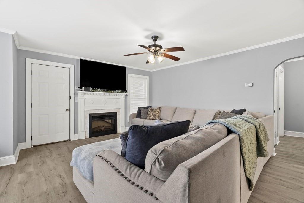 601 Juniper Avenue Dalton, GA 30721 - Photo 18 of 18 a living room with furniture a flat screen tv and a fireplace