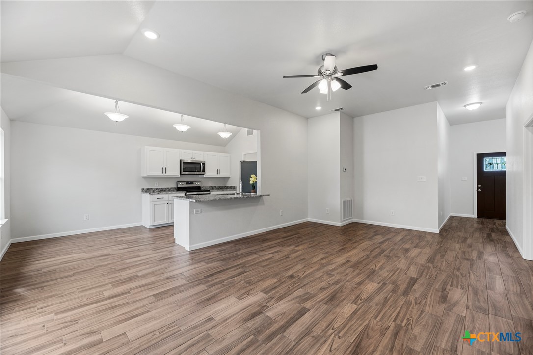 230 Plum Street Luling, TX 78648 - Photo 16 of 33 a view of kitchen with sink microwave and stove