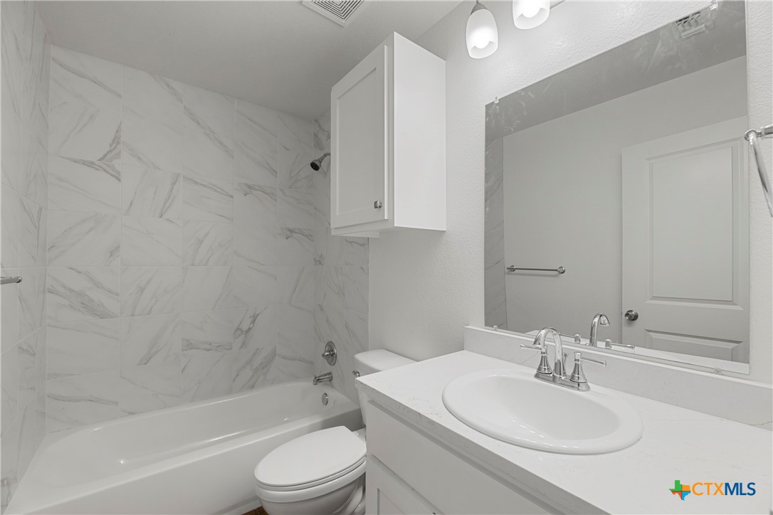 230 Plum Street Luling, TX 78648 - Photo 26 of 33 a bathroom with a sink toilet and a bathtub