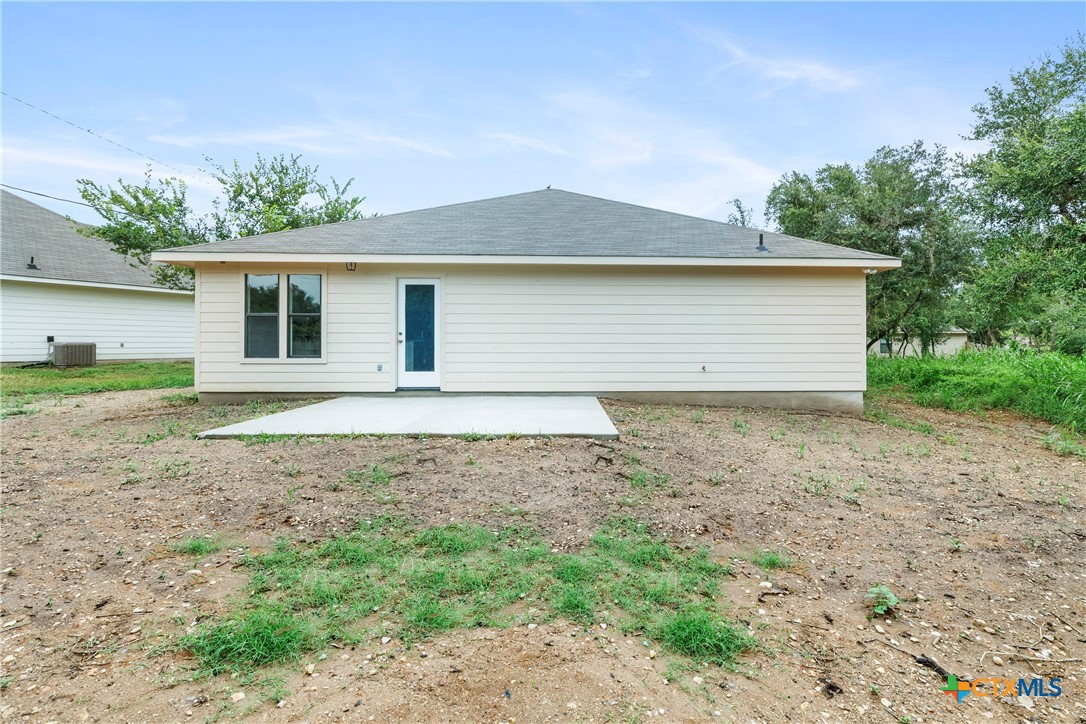 230 Plum Street Luling, TX 78648 - Photo 33 of 33 a view of house with a yard and potted plants