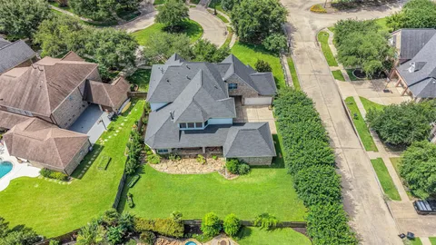 an aerial view of a house with a garden