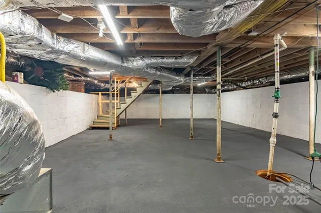 a view of an empty room with windows